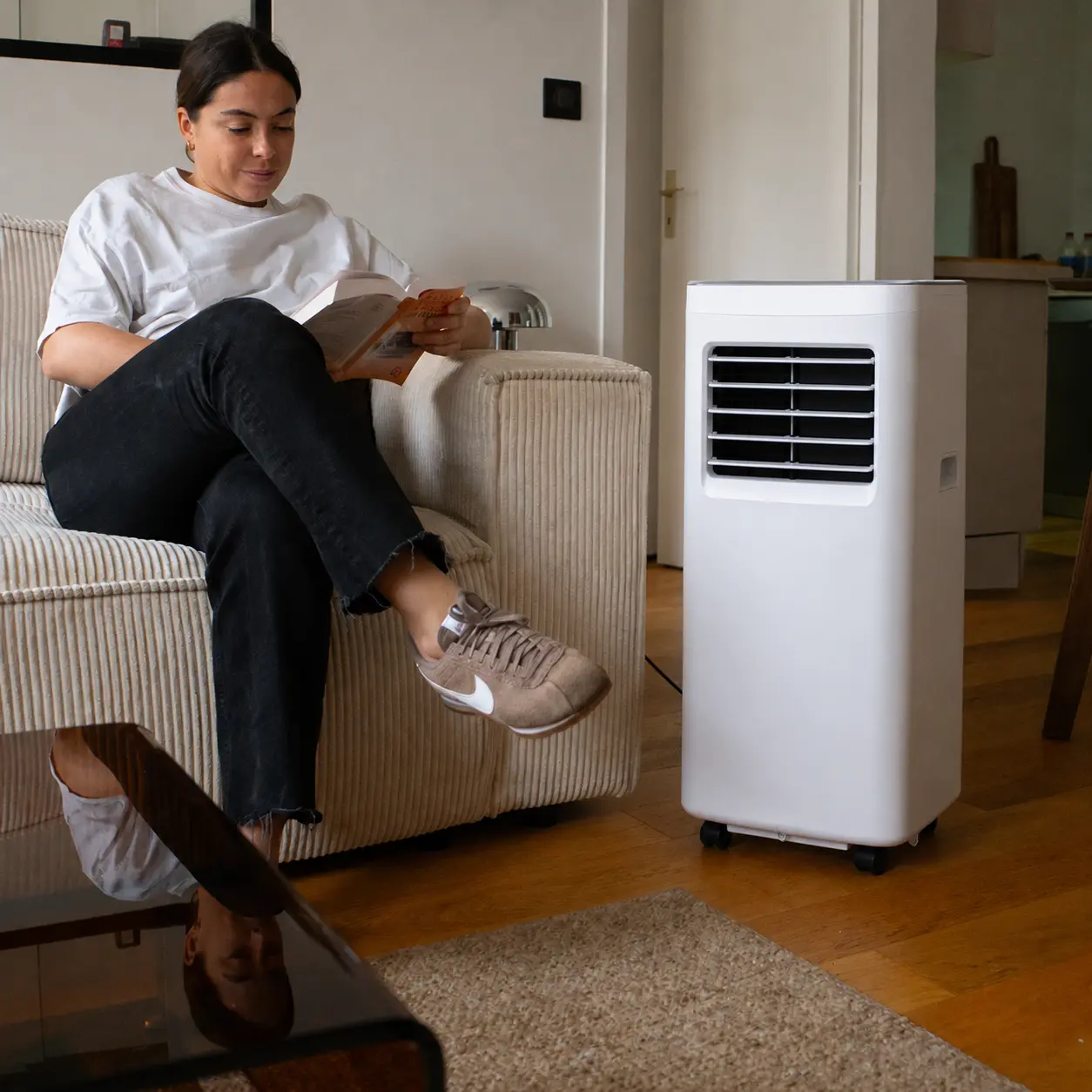 Portable air conditioner cooling a living room on a hot summer day
